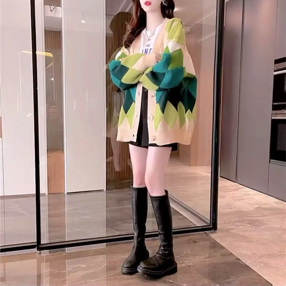 Green and cream harlequin patterned button up sweater
